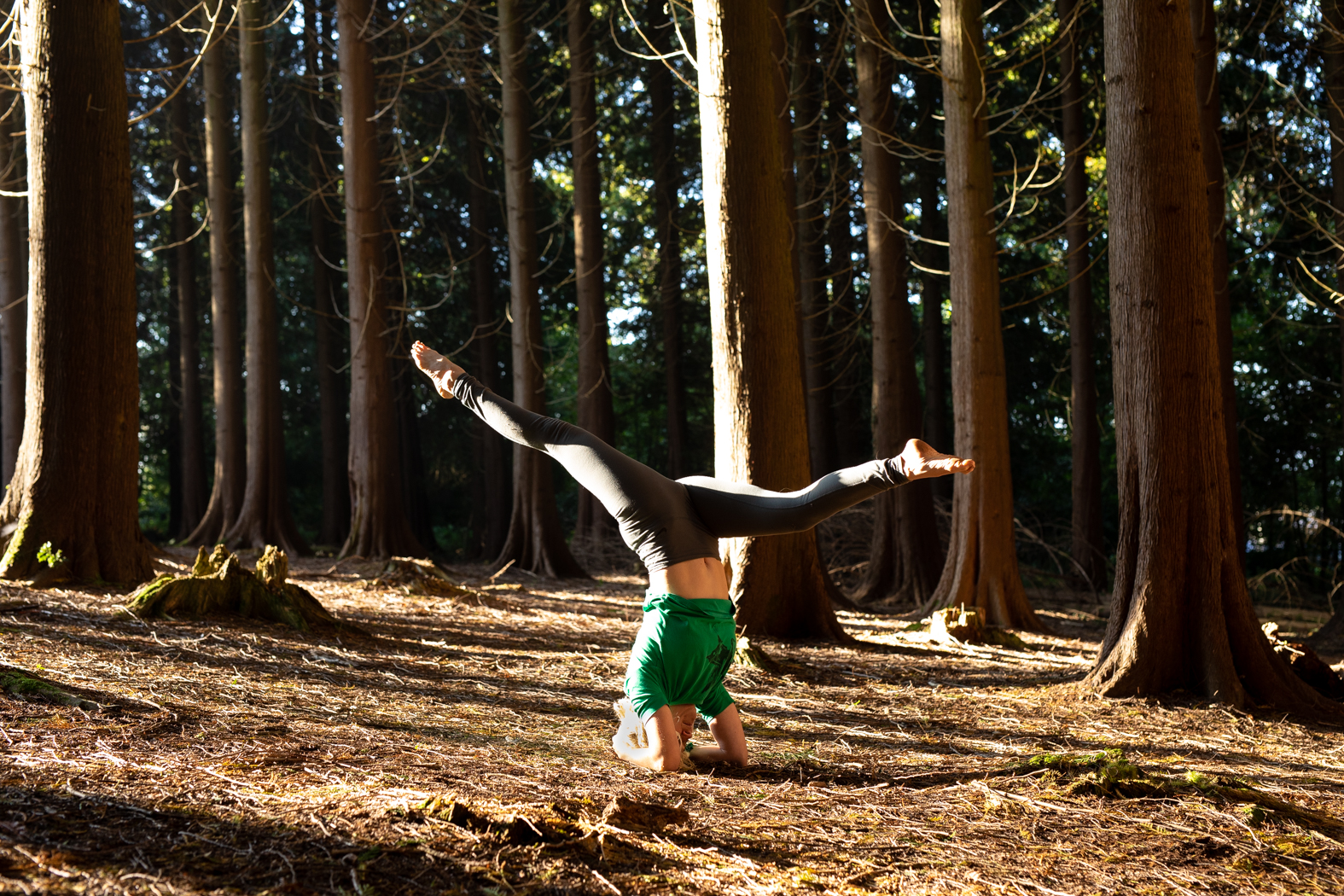 Gina headstand in forest