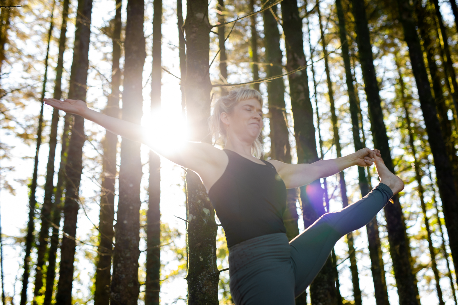 Gina in sunlit forest