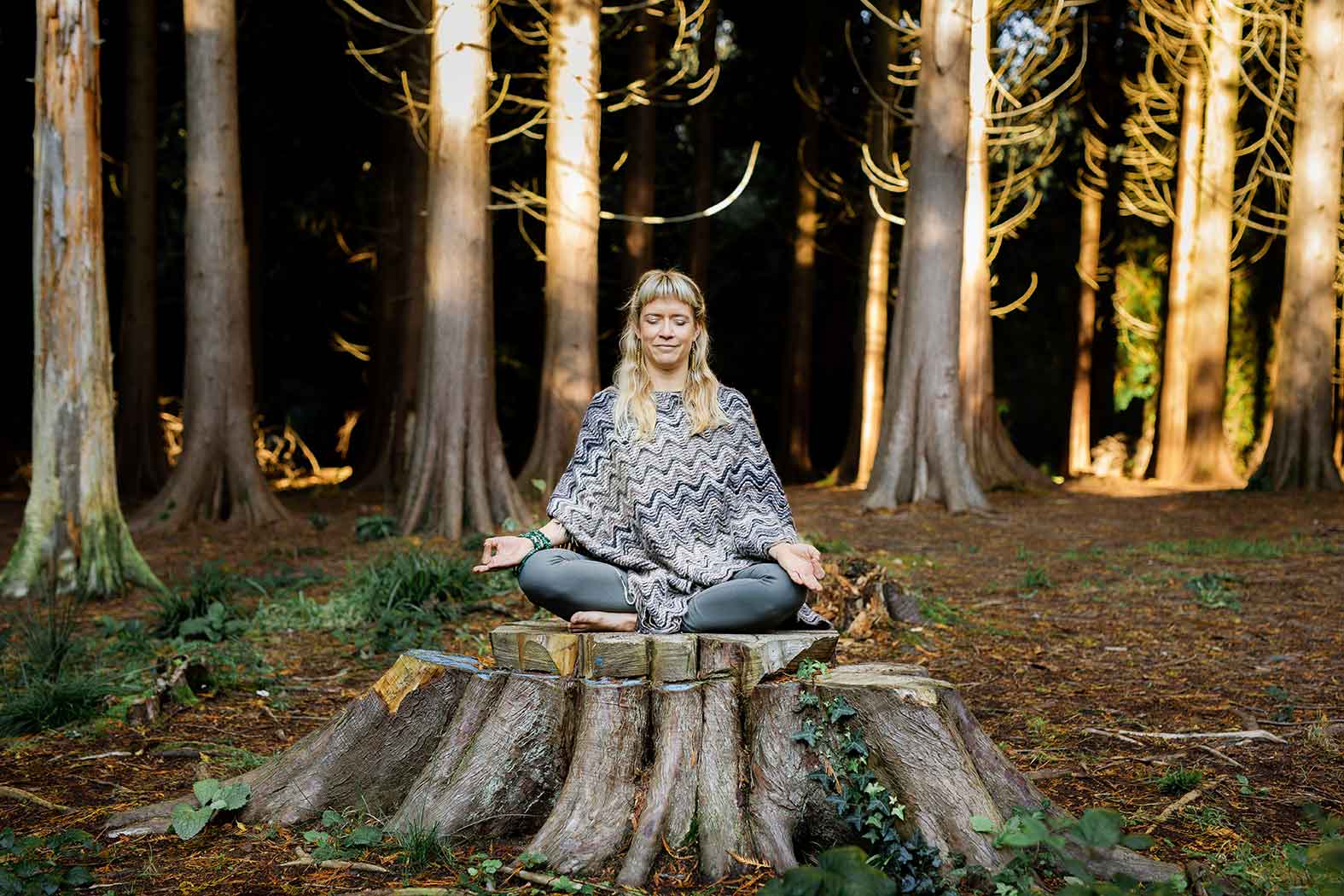 Gina meditating in the forest