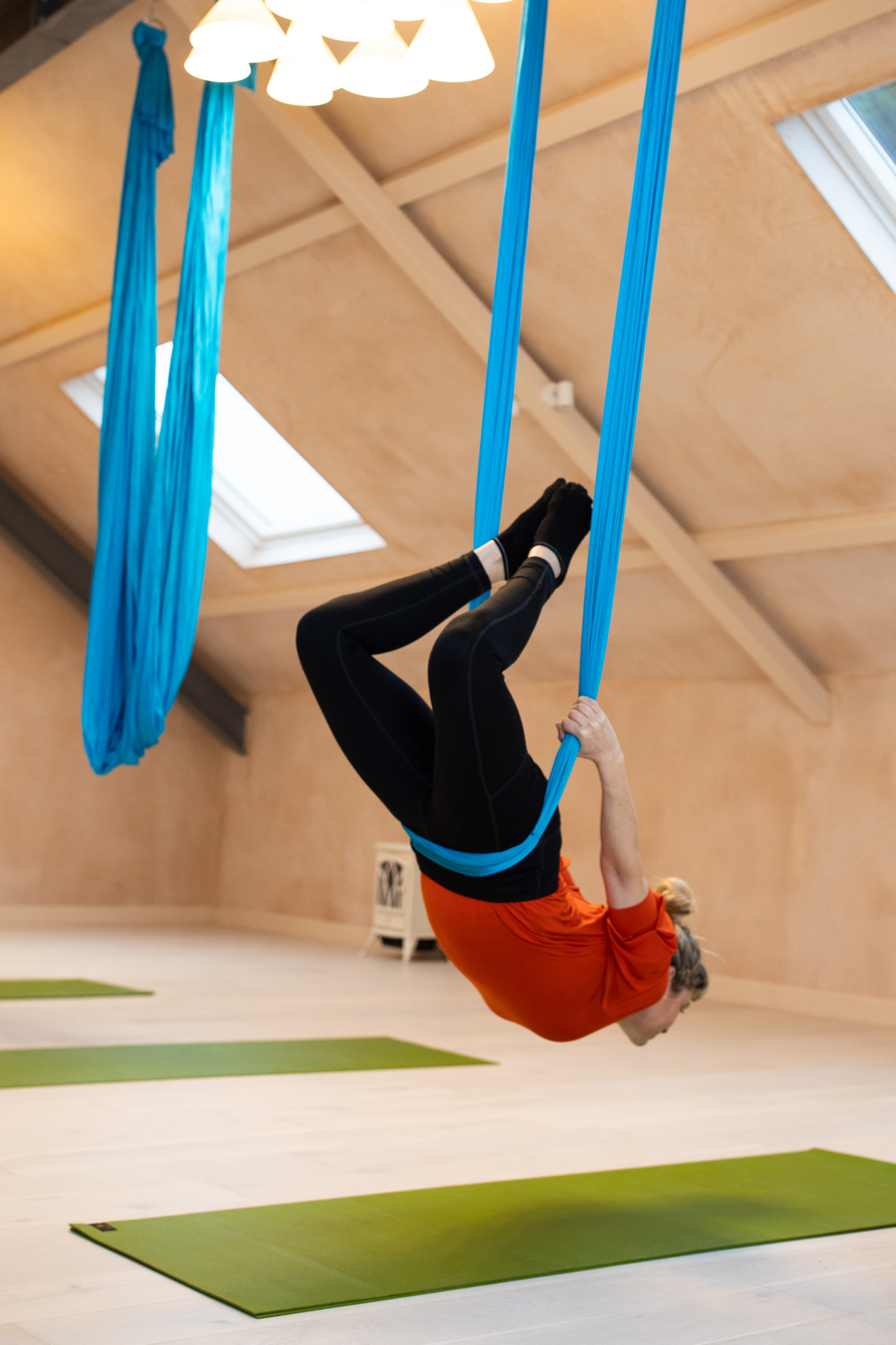 Gina suspended in silks