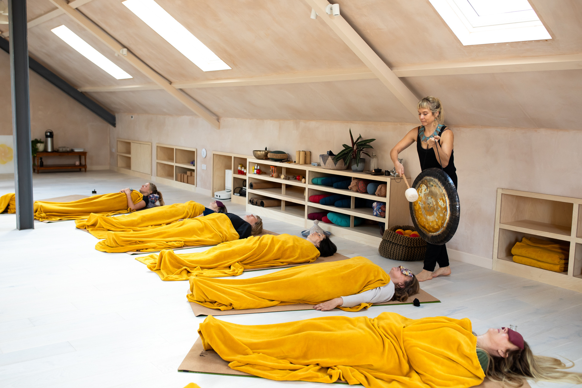 Gina playing gong in studio